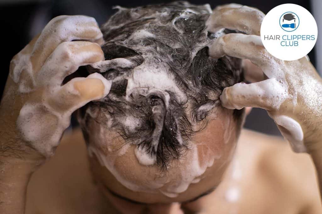 Man shampooing hair